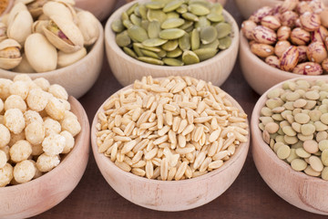 Oat grains in wooden bowl