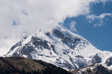 Kazbegi peak hidden in clouds, Georgia