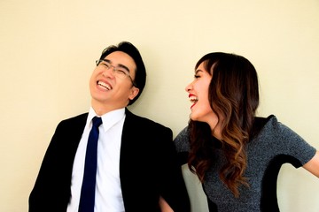 Happy businessman and woman at work