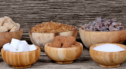 Plakat Bowls with various kinds of sugar on table