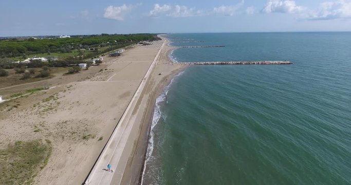 Italy coast of Eraclea sea view from the top to the beaches, piers and road near the sea