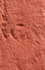 Fragment of a wall made of red fire-brick