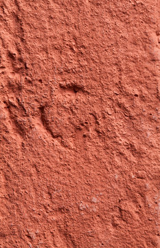 Fragment of a wall made of red fire-brick