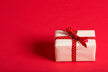 Small present box on a red background
