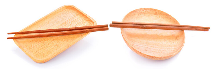 Wooden plate and chopsticks on white background