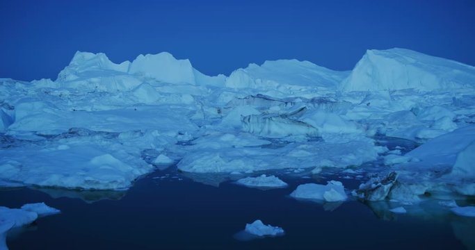 Icebergs floating in Disko bay in Greenland