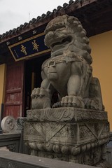 Traditional Stone lion in the door of a temple. Shanghai, China.