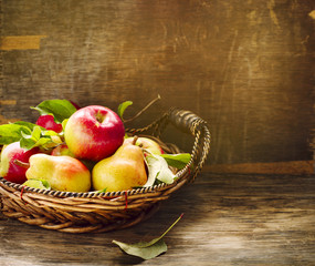 Fresh apples and pears on wooden table. Autumn Harvest