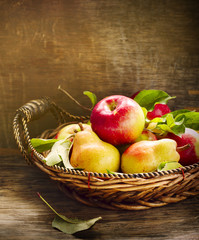 Fresh apples and pears on wooden table. Autumn Harvest