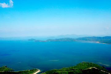 Island and sky view - photo through clear glass