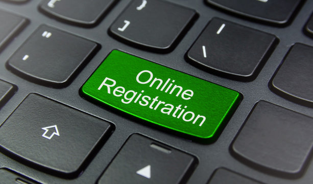 Close-up the Online Registration button on the keyboard and have Green color button isolate black keyboard