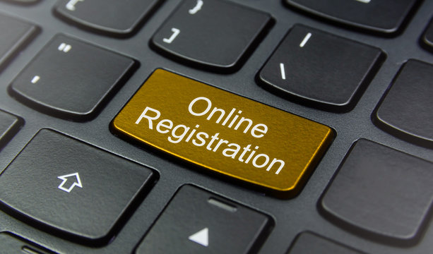 Close-up the Online Registration button on the keyboard and have Yellow color button isolate black keyboard