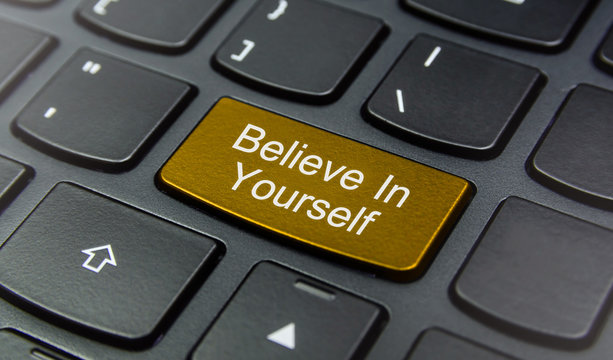Close-up the Believe In Yourself button on the keyboard and have Yellow color button isolate black keyboard