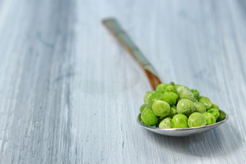 Frozen peas in a spoon