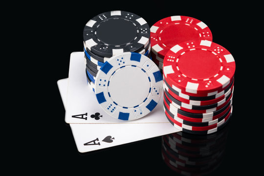 two large black cards to play poker under the poker chips