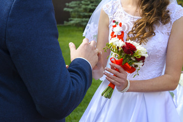 Beautiful and happy young bride and groom in wedding dress on a sunny day. Ukrainian wedding, culture, ethical traditions, concept. Autumn of 2017.