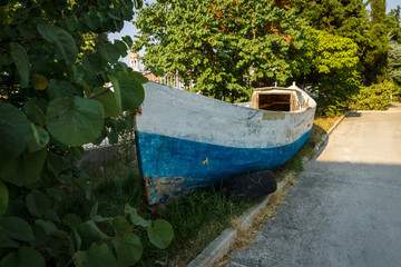 An old wooden boat on the shore.