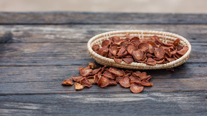 fresh betel nut with betel leaf in basket on the wood background,