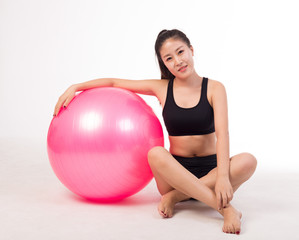 Fototapeta na wymiar asian girl playing yoga ball
