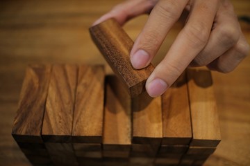 Planning risk and strategy in businessman gambling placing wooden block.Business concept for growth success process