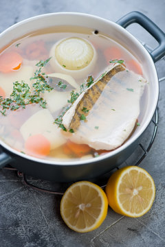 Bowl with freshly made sudak fish soup, selective focus, close-up