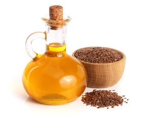 linseed oil with flax seeds isolated on white background