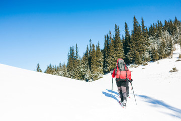 Two climbers are in the mountains.