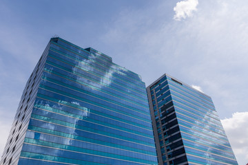 Exterior glass office building with sky and cloud
