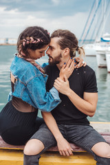 Guy and girl on pier