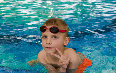 Cute little boy in swimming pool