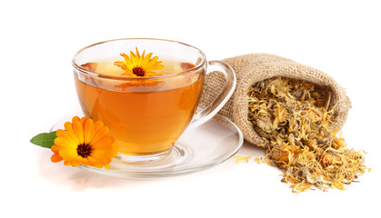 Calendula tea with fresh and dried flowers isolated on white background