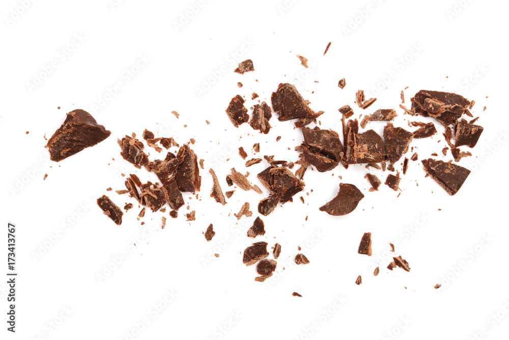 Wall mural grated chocolate isolated on white background. top view