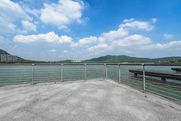 empty brick floor front of Lakes and Mountains