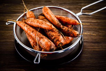 Raw vegetables on wooden background