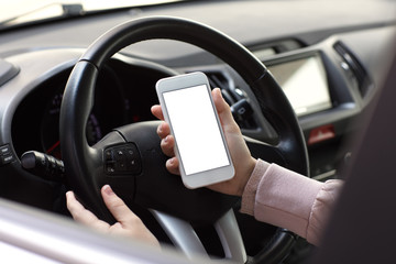 Female hands holding phone with isolated screen behind wheel car