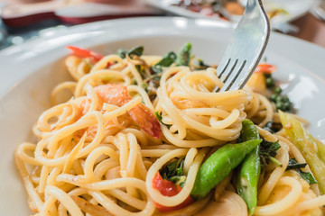 closeup Spaghetti with Cutlery on white plate . Italian food .