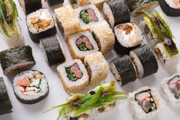 Set of sushi, maki and rolls isolated on white background closeup