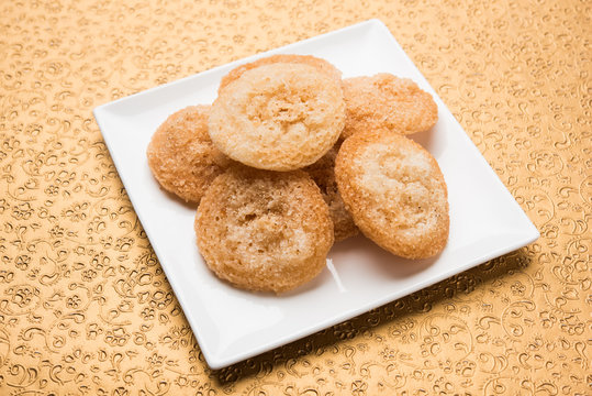 Stock Photo of Anarsa which is an authentic Maharashtrian sweet pastry-like dish especially made in the festive season in Maharashtra and Bihar, selective focus
