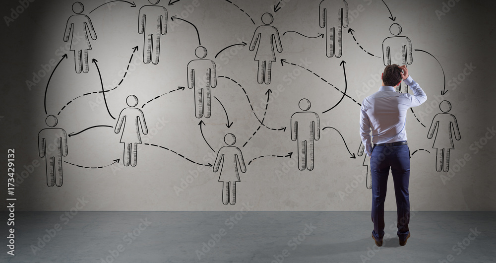 Aufkleber businessman watching social network sketch on a wall 3d rendering