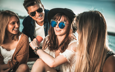 Friends having fun and enjoying beach festival, youth concept