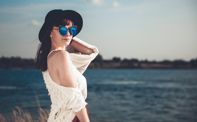 Styled hippie girl at the beach, boho fashion