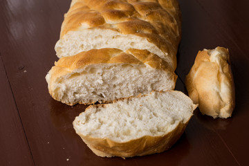 Homemade domestic bread sliced on the table