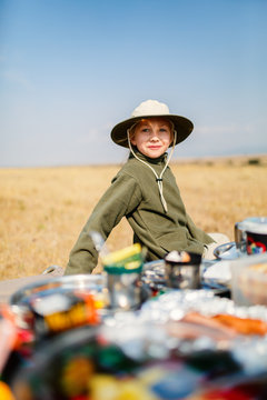 Little girl on safari bush breakfast