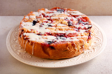 Mixed fruit cake with icing drizzle