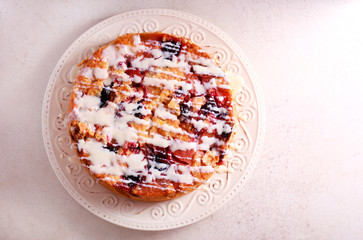 Mixed fruit cake with icing drizzle over