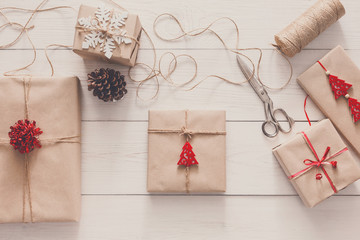 Wrapping christmas holiday present with craft twine