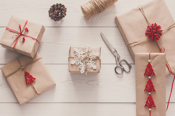 Christmas gifts and presents in craft paper, top view background