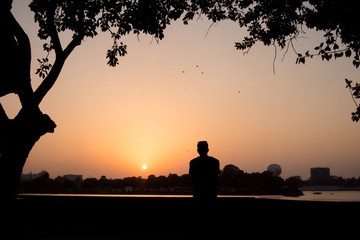 Young man seeing a sunset