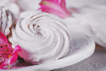 Sweets and desserts, soft, airy and sweet white marshmallows on a gentle light background