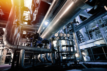 Equipment, cables and piping as found inside of a modern industrial power plant